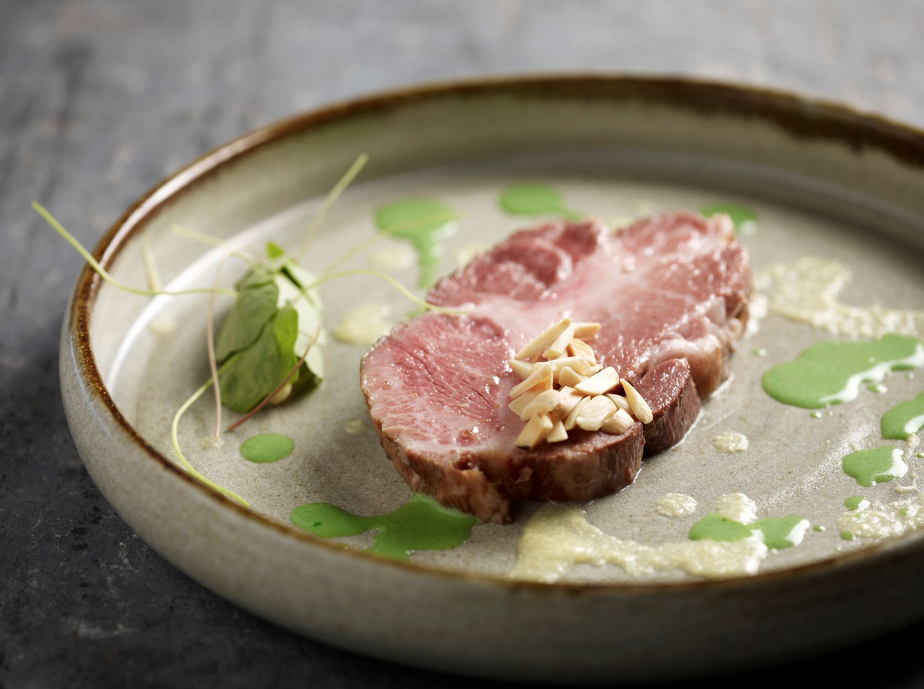 Iberico pork collar, lemon crème fraiche, chamomile onions, chervil sauce and topped with toasted hazelnuts